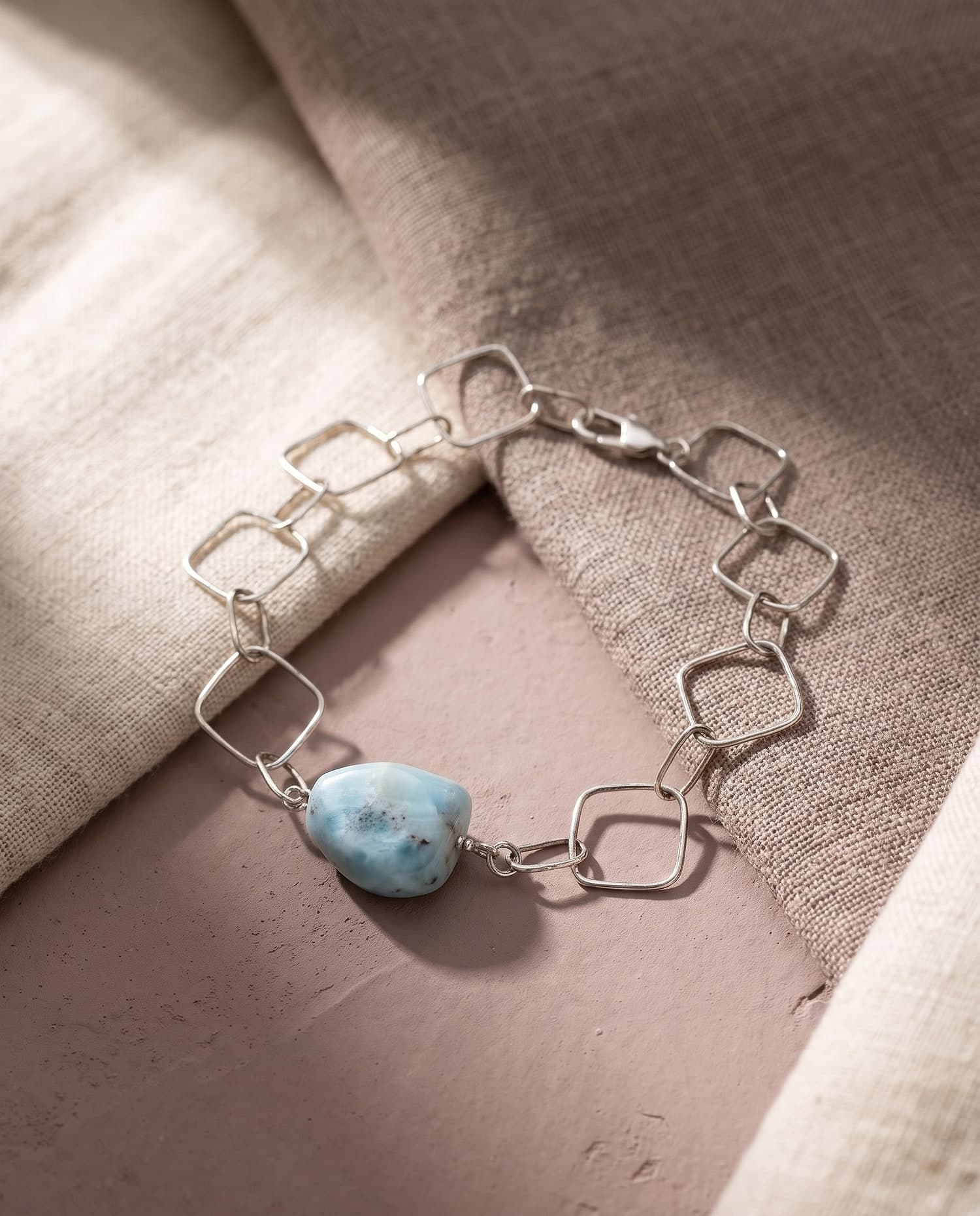 Larimar & Geometric Silver Chain Bracelet — hand-set in New York, styled on natural linen